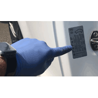 Image with a finger pointing at placard